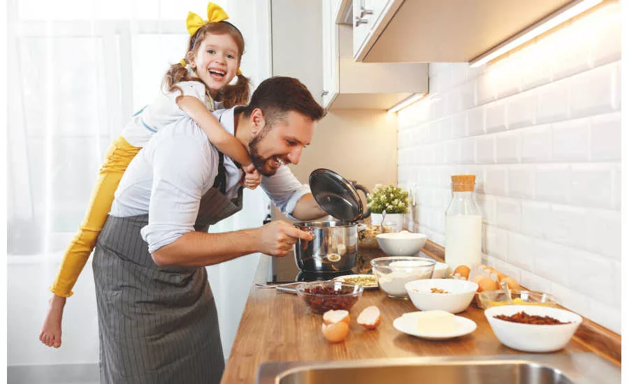 Girl cooking with her father plant-based protein