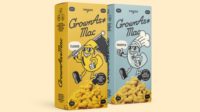 Image of Grown As* mac and cheese boxes in front of a light yellow background