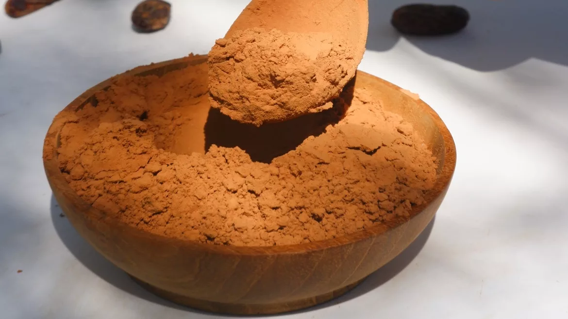 Image of cocoa powder in a wooden bowl