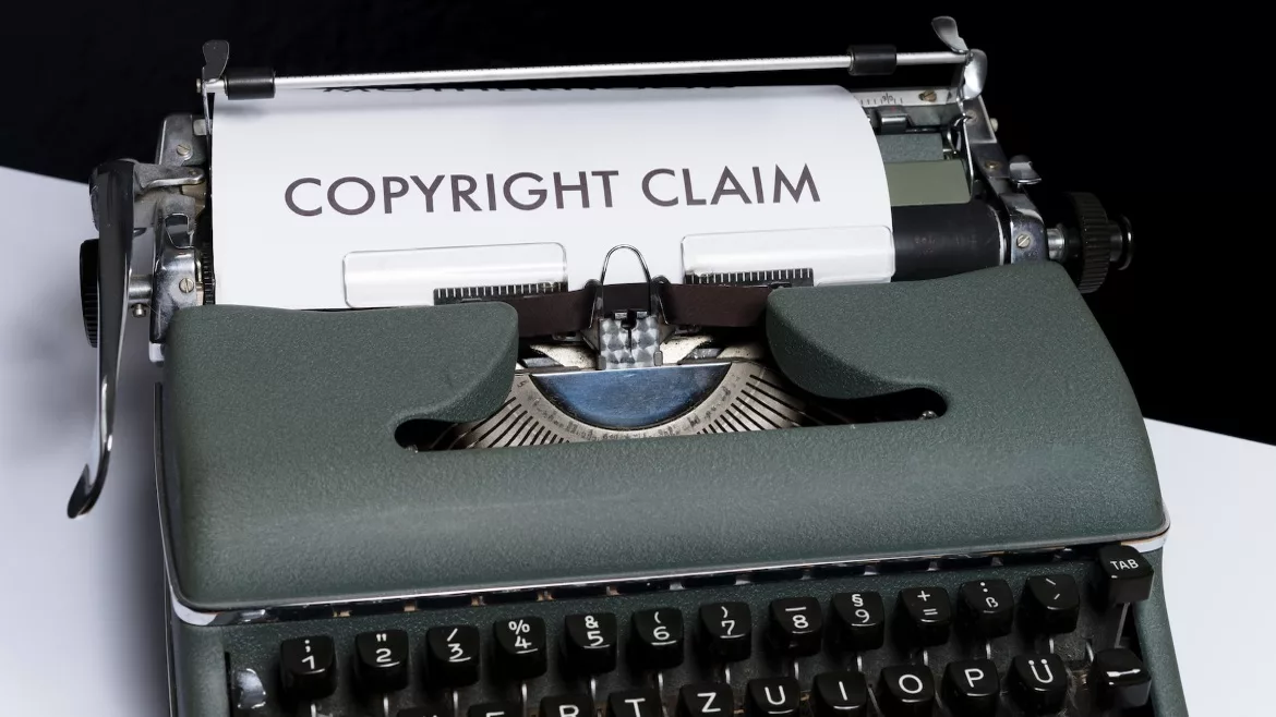 a piece of paper in a typewriter that says, "copyright claim"