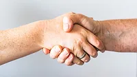 Two people shaking hands Two people shaking hands