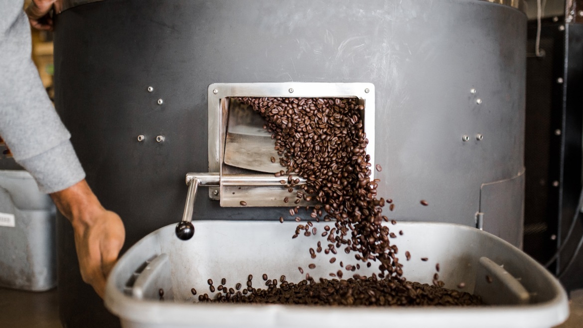 Processing coffee beans into a bin