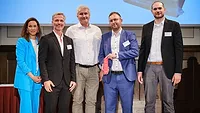 SŨDPAK attendees holding the award and standing next to eachother SŨDPAK attendees holding the award and standing next to eachother