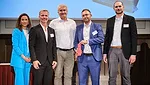 SŨDPAK attendees holding the award and standing next to eachother