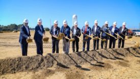revalyu leadership lined up with shovels at its groundbreaking ceremony