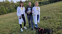 Image of three BioCraft leaders outside in a field next to two dogs. Image of three BioCraft leaders outside in a field next to two dogs.