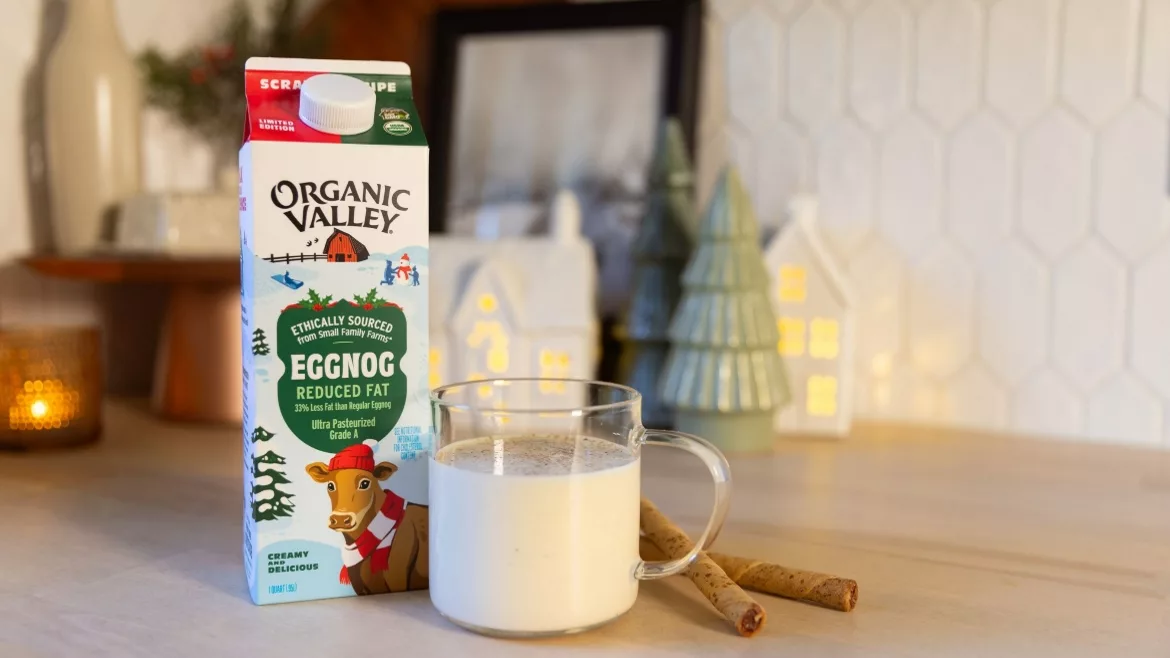 Organic Valley Eggnog carton next to a glass of eggnog