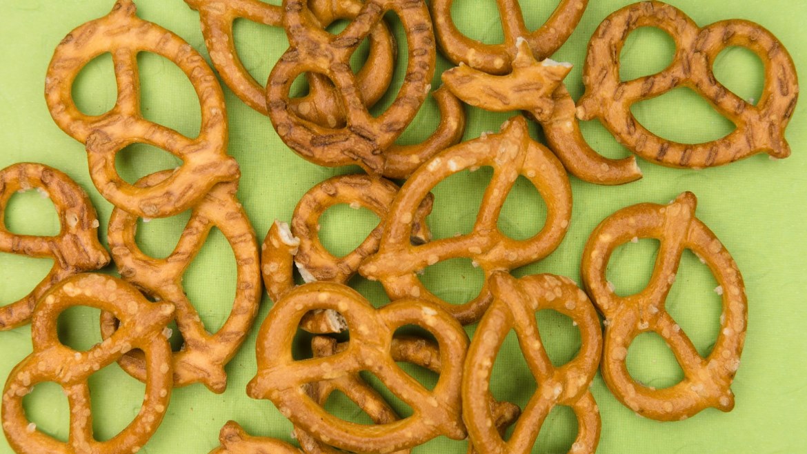 Pretzels laying on a green background