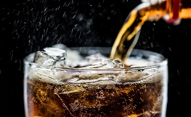 Carbonated soda poured into a glass