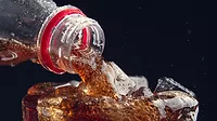 Pouring soda in a glass