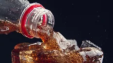 Pouring soda in a glass