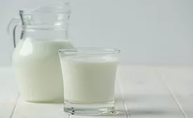 Milk in glass and pitcher