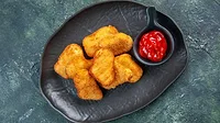 Chicken nuggets Chicken nuggets with ketchup