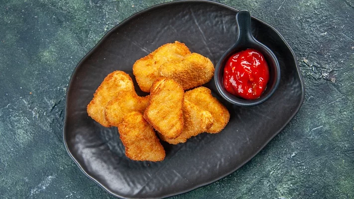 Chicken nuggets with ketchup