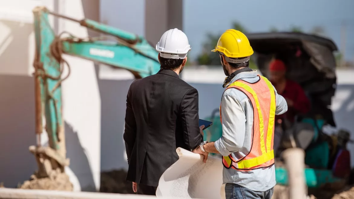 Construction worker and engineer