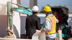 Construction worker and engineer