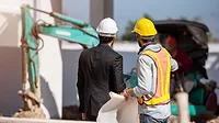 Construction worker and engineer