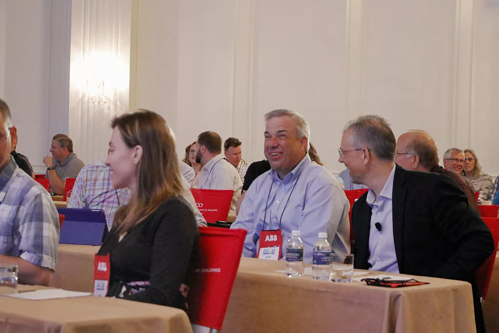 John Sivulka of Kinsley Construction, Inc. networking with two attendees a the 2019 Food Automation & Manufacturing Symposium and Expo.