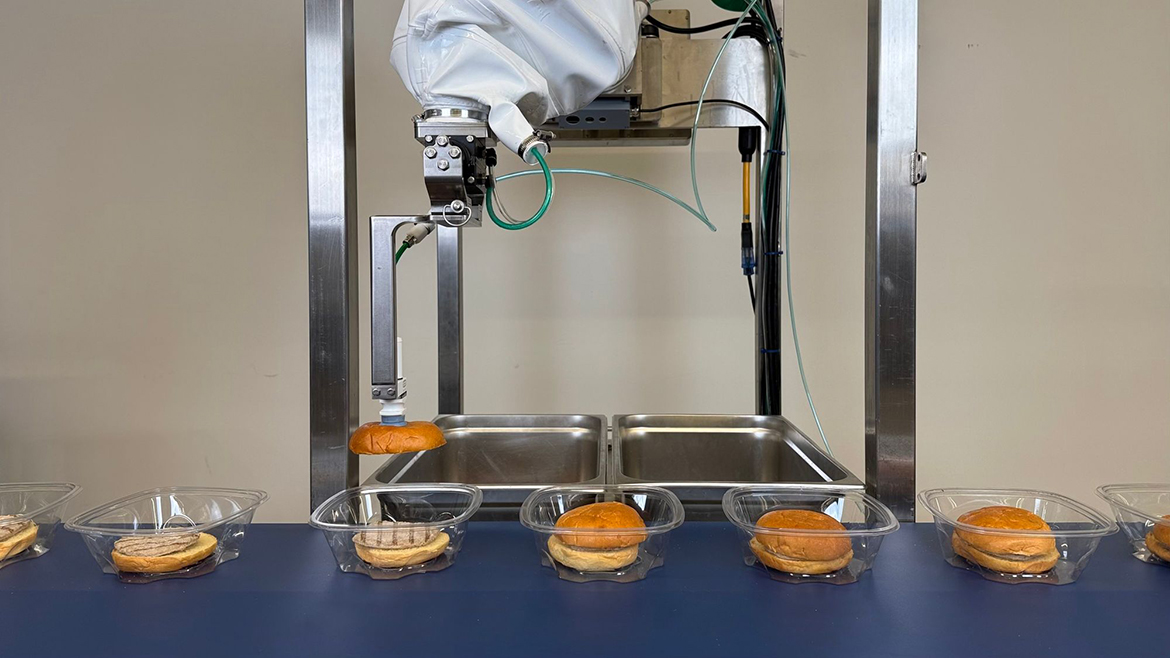 Chef Robotics robots building a hamburger piece by piece.