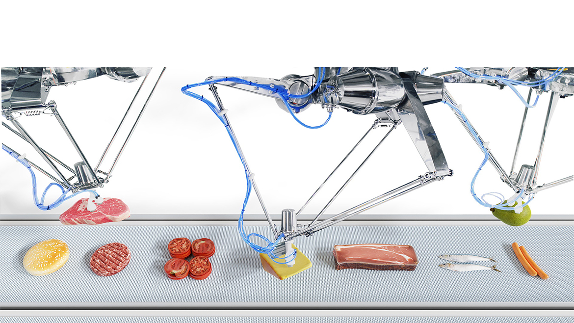 Delta-style robots assembling food on a conveyor belt.