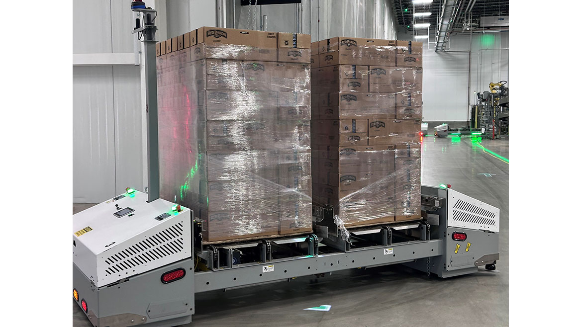 AMR transporting two pallets of 'Red Baron Classic' frozen food boxes in a warehouse.