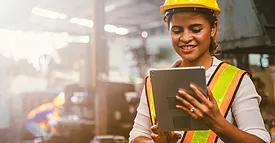 Working in safety gear on her tablet.