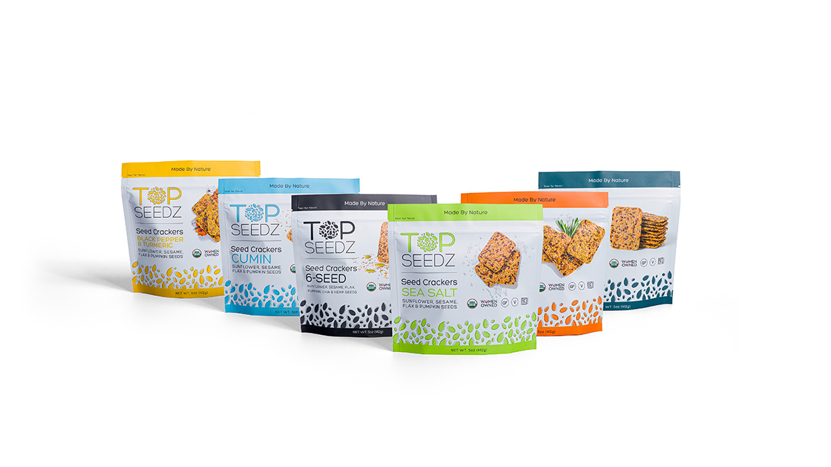 A variety of Top Seedz packages in a row on a white background.