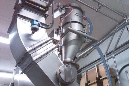 Nutriom uses two VAC-U-MAX pneumatic conveyors with a mixer. One system breaks up the powder and puts it into the mixer, while the other pulls it out of the mixer. 