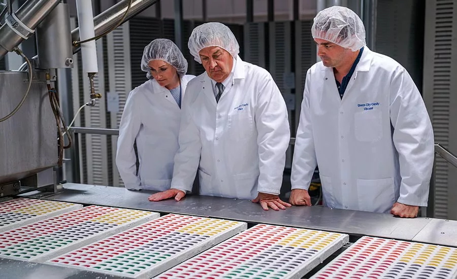 Queen City Candy execs inspect candy