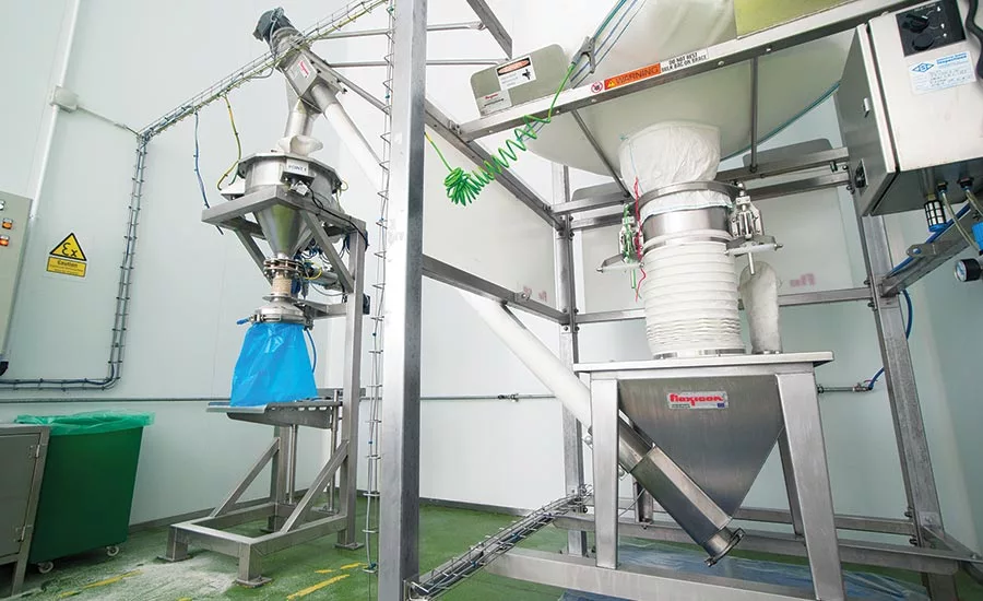 conveying sugar from discharger to hopper