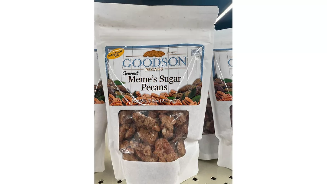 Image of a stand-up pouch with a translucent window showing sugared pecans. The bag says “Goodson Pecans, Gourmet Meme’s Sugar Pecans and Georgia Grown.”