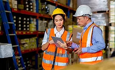 warehouse-worker-standing-by-storage-rack