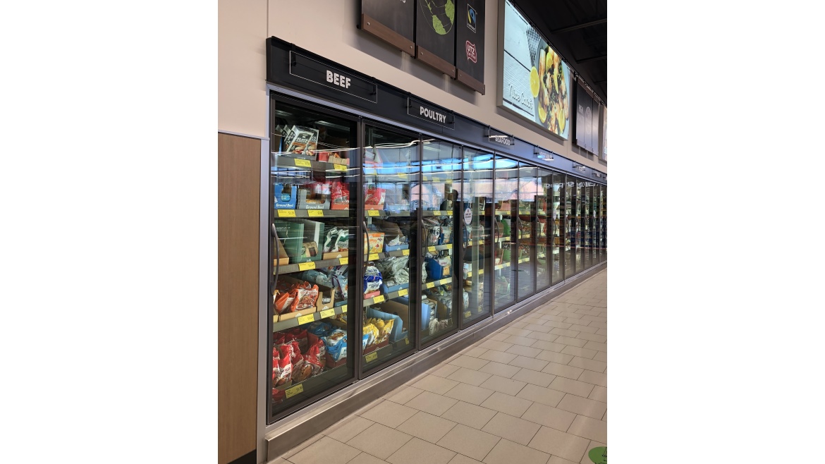 Fully stocked refrigeration units in the food bank.