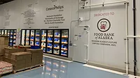 Interior of the food bank with the logo of ‘The Alaskan Food Bank’ on a wall. Interior of the food bank with the logo of ‘The Alaskan Food Bank’ on a wall.
