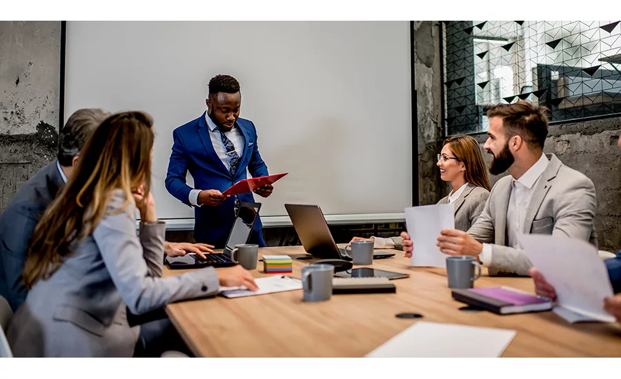 people planning around a conference table