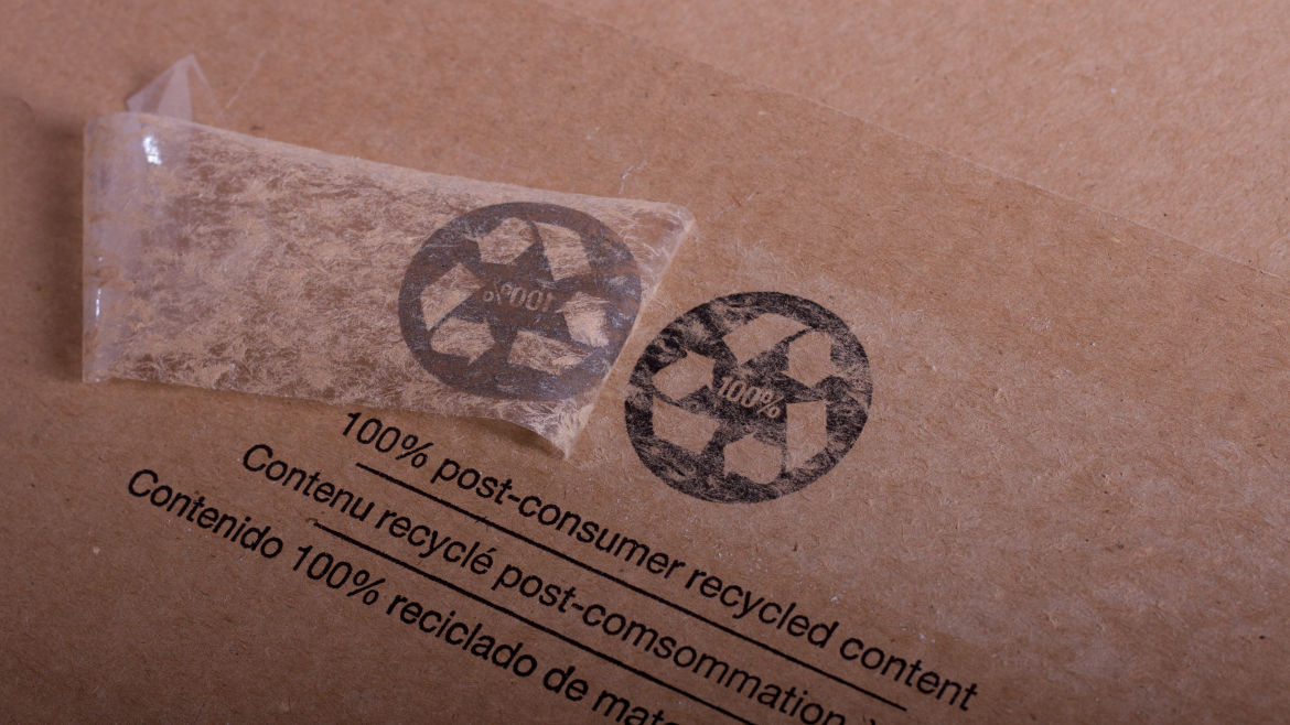 Tape peeled off a 100% Post-Consumer Recycled Content logo