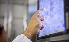 manufacturing worker looking at a screen
