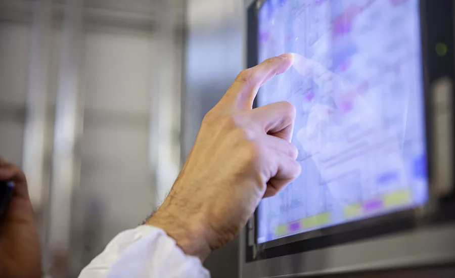 manufacturing worker looking at a screen