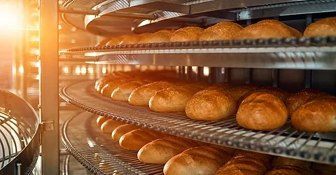 Rows of baked bread on racks