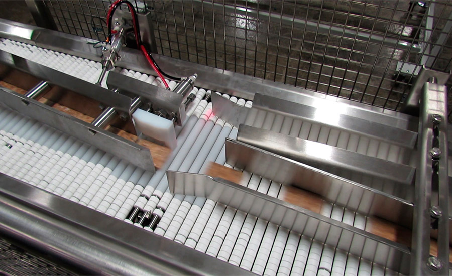 Automated diverter feeds bars to each of the line’s shrink wrappers on conveyors with Slip-Torque technology, which minimizes product damage. Source: Shuttleworth Inc.