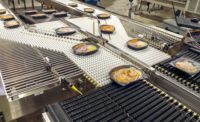 Conveying ready-to-eat meals through production processes
